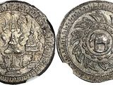 a silver coin with an image of a man and a woman on it