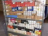 a metal cart with many boxes on it in a warehouse