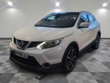the white nissan qx sport suv is parked in a garage