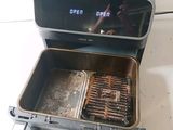 an open oven that has a grill inside of it