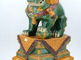 an image of a statue of a lion sitting on top of a box