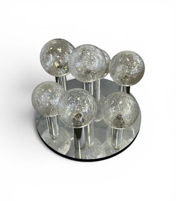 a glass plate with a bunch of glass balls on it
