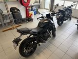 two motorcycles that are parked in a garage