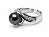 an image of a black pearl and diamond ring on a white background