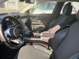 the interior of a car with a steering wheel and dashboard controls