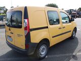 a small yellow van parked in a parking lot