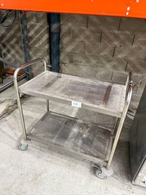 a metal cart that is sitting on the ground