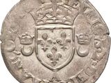 gros plan d'une pièce de monnaie surmontée d'une couronne