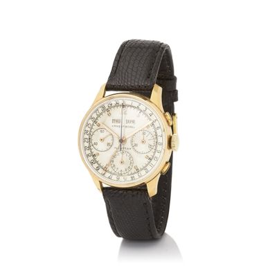 a close up of a watch on a white surface with a white background