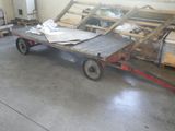 a cart with a lot of wood on it in a garage