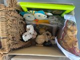 a basket full of stuffed animals sitting on a chair