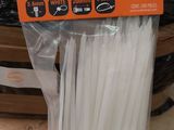 a bunch of white plastic cable ties in a package
