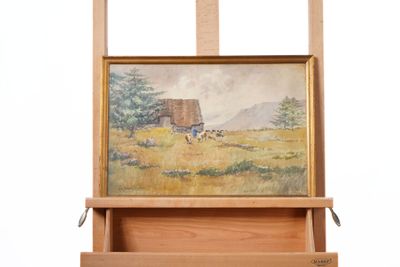 une photo d'un tableau accroché à un chevalet en bois