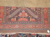 an image of a rug on the floor with a tag on it