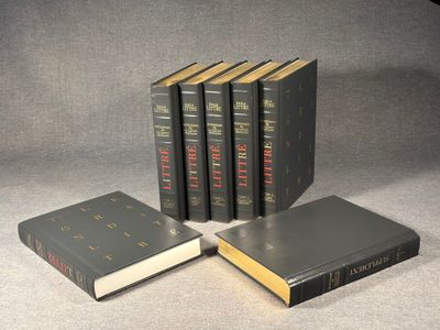three books sitting on top of a table next to each other