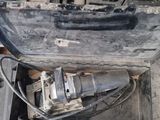 an open suitcase with tools inside of it on the ground