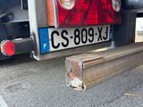 a truck that has a red tail light on the back of it