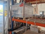 a large rack with many boxes on it in a warehouse
