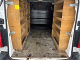 a white van that has some shelves inside of it