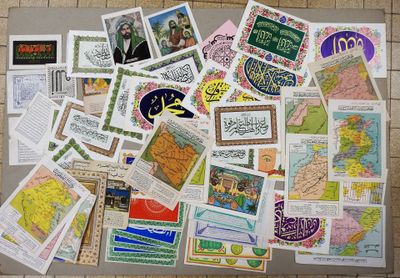 a lot of postcards on the floor of this room