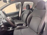the interior of a car with black leather seats and a steering wheel