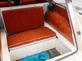 a seat in the back of a car that is open