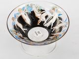 a glass bowl with a picture of a group of nudes on it