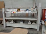 a picture of a workbench in a garage with a lot of tools
