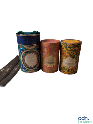 three tins that are sitting next to each other