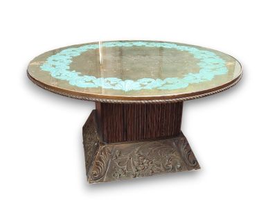 a table with a glass top and a metal base