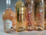 several bottles of wine are lined up on a table