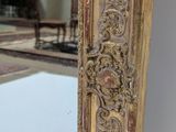 a mirror that is sitting on the floor in a room