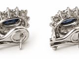 pair of blue sapphire and diamond earrings on a white background