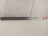 a close up of a piece of metal on a white surface
