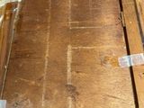 a piece of wood that has been stripped off and is sitting on the floor