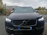 the front of a black volvo suv parked in a parking lot