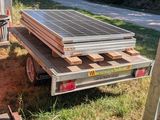 a truck that has a solar panel on the back of it