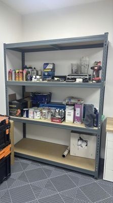 a room that has a shelf with many different items on it