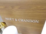 a wooden sign that says moet and chandon on it