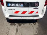 a white van that is parked on the side of the road