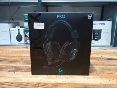 a box with a pair of headphones sitting on top of a wooden table