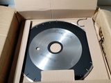 a box with a disc inside of it on a table