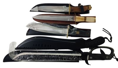 several different types of knives are lined up on a white surface