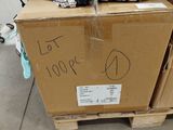 a cardboard box with a sign on it sitting on a pallet