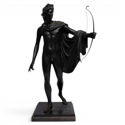 an image of a statue of a woman holding a bow and arrow