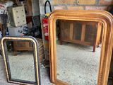 two mirrors sitting next to each other on the floor