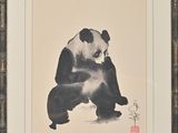 tableau représentant un panda assis par terre, dans un cadre