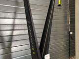 an image of a gym equipment stand in front of a garage door