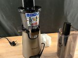 a juicer and a blender sitting on a table