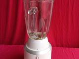a blender that is sitting on a red table